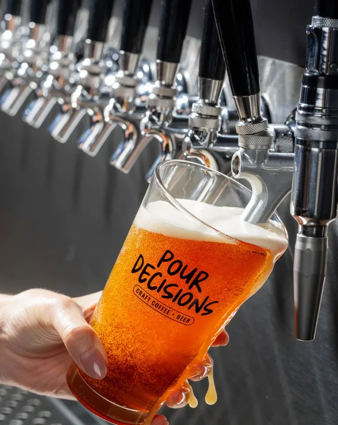 Craft beer poured from the tap wall